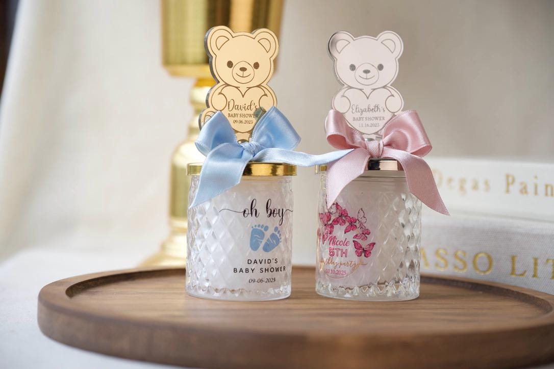 Welcome Baby Shower Favor Glass Jar Keepsake Teddy Bear Topper Custom Text Design Silver Mirror Lid Quilted Pattern Detail Nursery Room Decor First Birthday Party Gift Special Occasion Present Infant Room Decoration Beautiful Ribbon Accent